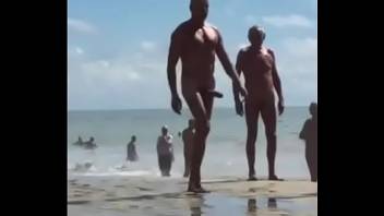 Crown with huge cock walking on the beach